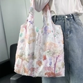Detailed side view of canvas tote bag with 3D fringe texture carried by a model - Abstract Floral Undersea Pattern Vest Bag