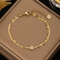 Detail of gold-plated double-layer stainless steel bracelet with a white zircon stone - Gold Double Layer Single Zirconia with Heart Tail