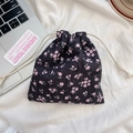 Detail showing pink floral bubble texture fabric and white cotton drawstring closure - Black with Pink Floral