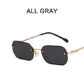 Vintage metal small frame sunglasses with dark gray lenses and golden spiral temples - Solid Grey