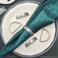 Modern silver matte D-shape and O-ring metal napkin rings on a green dinner napkin - Zinc Alloy / Matte Silver D-Shape