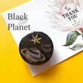 Planet phone grip with gold stars and glitter design on a bright yellow background - Expanding Stand / Black Planet