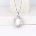 Oval shaped silver stainless steel locket necklace with decorative border on white background - Oval Ruyi 24*16/Steel