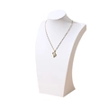 Golden heart pendant necklace with main stone inlay on a white neck mannequin stand - White Leather