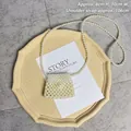 Mini handmade pearl woven crossbody bag with large pearl clasp on elegant display - Pearl Dumpling Bag Finished (8x10cm)