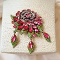 Close-up of a vintage Baroque rose brooch with pink rhinestones and gold leaves - Style 4 (Pink Rose Antique Gold)