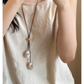 Detail of adjustable wax cord necklace with white marble beads and wooden slider - Coffee Cream Marble Pattern Bead