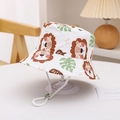 Detail of white cotton sun hat featuring cartoon lion prints and adjustable chin strap - White Lion