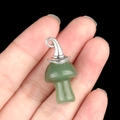 Green crystal mushroom pendant with silver wizard hat detail on finger - Gun Black Cap / Green Aventurine