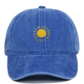 Close-up of yellow sun embroidery on blue vintage washed cotton baseball cap - Sapphire Blue