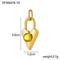 Detalle macro del colgante de corazón dorado con gema amarilla tallada y dimensiones - Oro-Piedra Amarilla