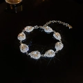 Detail of silver waterdrop jewelry set with sparkling crystals and lobster clasp closure - Water Drop Rhinestone Bracelet / Silver