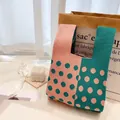 Pink and dark green knitted tote bag with large polka dots and woven texture detail - Emerald Green