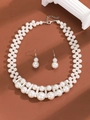 Detailed close-up of multi-layer pearl necklace and earring set with silver hardware - Trendy Woven Simulated Pearl Necklace Earring Set