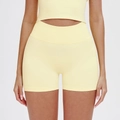Seamless high-waisted yoga shorts in light yellow with a supportive ribbed texture - Moonlight Yellow