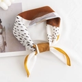 Retro houndstooth silk scarf in brown and yellow tones tied as a stylish hair band - Colorful Geometric / Orange Edge