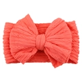 Elastic nylon baby headband with large cable knit bow in vibrant coral orange color - Watermelon red