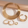 Detailed set of gold geometric multi-layer metal necklaces, bracelet, earrings, and ring - Four-Piece Set / Gold