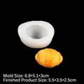 White silicone croissant mold with finished yellow pastry model on black background - Small / Translucent