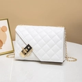 White quilted crossbody handbag with a gold chain strap and elegant metal lock closure - White