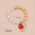 Beaded bracelet with white pearls and gold beads featuring a red ladybug pendant - Brass Red and Black Polka Dot Ladybug (10#)