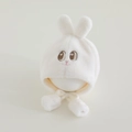Detalle de gorro de peluche blanco para bebé con orejas de conejo y pompones suaves - 6 meses - 2 años / Blanco Roto