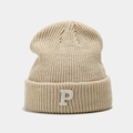 Detailed view of beige knit beanie with white fuzzy P letter patch and thick ribbed texture - Beige