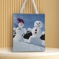 Detail of Christmas canvas tote bag featuring a snowman print and white fabric handles - Style 25