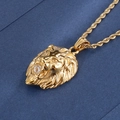 Detailed macro view of gold lion head pendant featuring a clear gemstone in mouth - Gold Lion Head With Twist Chain (KP42215-TOM) / Gold