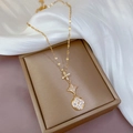 Titanium steel gold necklace with sparkling floral and star pendants on silk background - Gold (Titanium Chain Copper Pendant)
