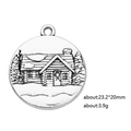 Detailed relief of a snowy cabin and trees on a silver alloy circular charm pendant - House