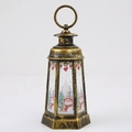 Detailed view of bronze Christmas lantern with festive snowman and tree pattern engravings - Snowman / Antique Gold