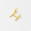 Detailed macro view of gold H-letter pendant with a polished mirror finish surface - Letter H / 925 Silver