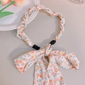 Floral headband with orange flowers, faux pearls, and a large bow tie detail - Orange Floral