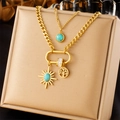 Close-up of gold layered chain necklace with tree of life and turquoise sun pendants - Tree of Life Sun Style (N2640)