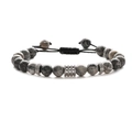 Detailed shot of grey marble beads and silver carved metal spacers on braided cord - Map