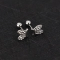 Detail view of silver butterfly stud earrings with sparkling cubic zirconia pavé and screw back - Rabbit - Steel