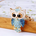 Sparkling rhinestone owl keychain with blue and white crystals on a gold metal base - Rhinestone Owl Blue