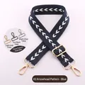 Detailed view of adjustable navy blue bag strap with white arrow pattern and hardware options - Blue
