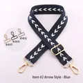 Detailed view of adjustable navy blue bag strap with white arrow pattern and hardware options - Blue