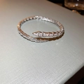 Macro shot of silver snake bracelet featuring pave set zircons and scale texture - Snake-shaped Zirconia Pavé Style / Silver
