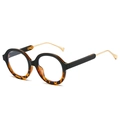 Vintage round sunglasses with black and tortoiseshell frames and gold metal temples - Black Tortoise Frame
