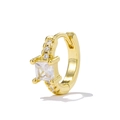Macro detail of gold huggie earring featuring a square zircon and micro-paved stones - Gold/Transparent
