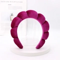 Close-up of a padded dark rose velvet headband with puffy cloud-like texture on a stand - Rose Red