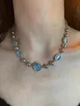 Silver bead chain necklace featuring sky blue gemstones shown on neck - Blue Cat's Eye Chain Splicing Necklace