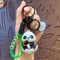 Cute panda keychain on pink lotus base with glowing feature and green silicone strap - Buddha Light Panda