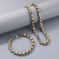 Detalle de conjunto de collar y pulsera bizantina de acero con motivos de llave griega - Collar / Bicolor (Oro y Plata)