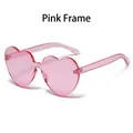 Chic rimless heart-shaped sunglasses in translucent pink for trendy street style look - Pink