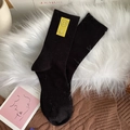 Chaussettes noires en coton côtelé pour femmes avec écusson jaune à motif smiley - Taille unique / Noir