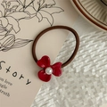 Detail of red flower hair tie with pearl center on vintage botanical card - Burgundy